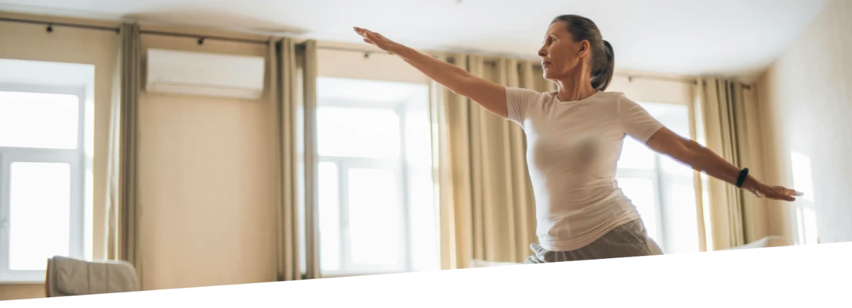 A woman doing yoga inside.