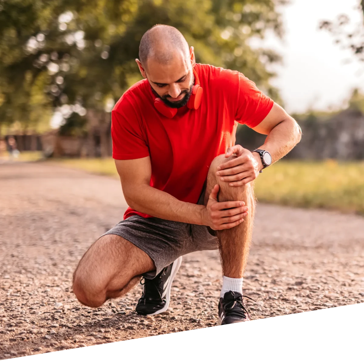 Man holds his knee due to discomfort or pain